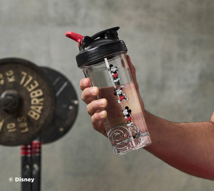 pro-series-j2 Mickey_Mouse_Protein_Shaker_Bottle_Being_Held_In_the_Gym.jpg